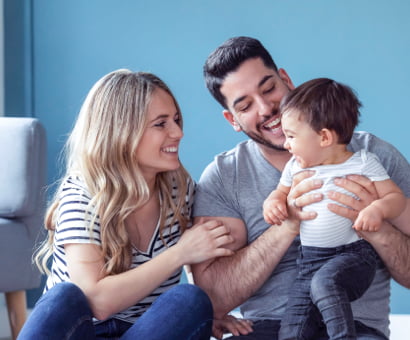 Wife and husband playing with their child