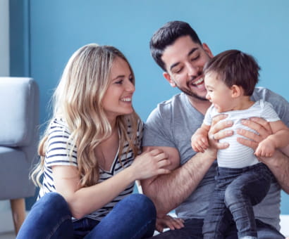 Wife and husband playing with their child