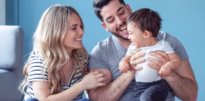 Wife and husband playing with their child